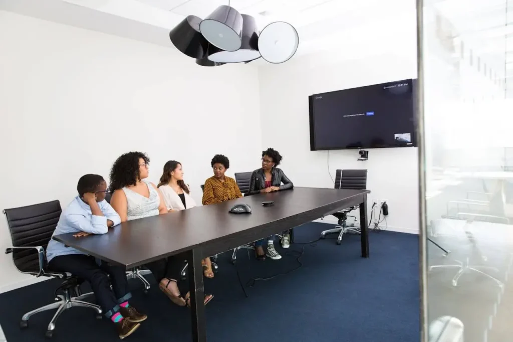Business team in a conference room discussing AI strategy 